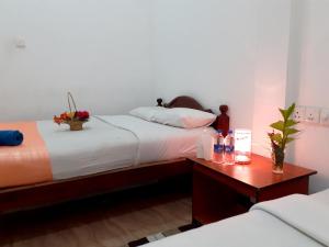 Postel nebo postele na pokoji v ubytování Subash Hotel
