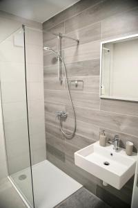 a bathroom with a shower and a sink and a mirror at Villa EnVi in Novalja +51 photos