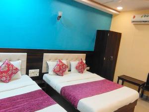 Postel nebo postele na pokoji v ubytování Hotel Golden Galaxy - Santacruz East