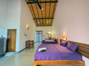 Кровать или кровати в номере Tropical Villa - Weligama