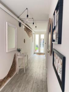 a living room with a table and a tv at MAISON REBECCA in Carpi