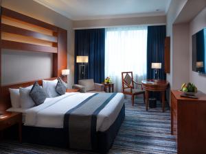 Cama o camas de una habitación en Retaj Al Rayyan