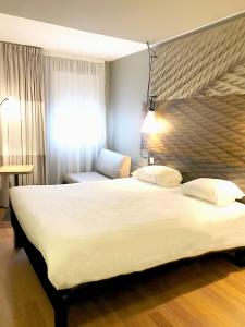 Postel nebo postele na pokoji v ubytování Hotel ibis Dijon Centre Clemenceau
