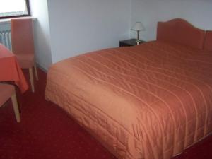 Postel nebo postele na pokoji v ubytování Hotel Am Ufer