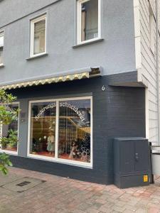 a store window of a store with dolls in it at Modern mitten in der Stadt und doch sehr ruhig in Bad Ems