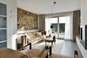 Posezení v ubytování Beachhouse Zonneweelde