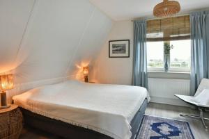 Postel nebo postele na pokoji v ubytování Beachhouse Zonneweelde