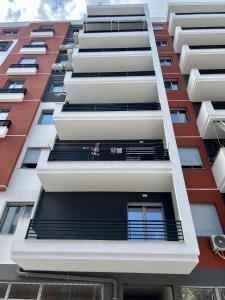 an external view of an apartment building at George apartments2023 in Korçë