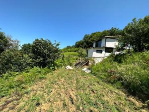 a house sitting on top of a grassy hill at Muhafazakar Müstakil Aile Villası 