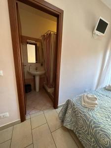 Postel nebo postele na pokoji v ubytování B&B Emmanuel