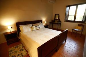 En eller flere senge i et værelse på Agriturismo Cascina Cipressa + 75 billeder