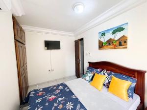A bed or beds in a room at Appartement de Standing AKWA