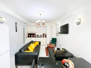 TV a/nebo společenská místnost v ubytování Appartement de Standing AKWA + 4 fotografie
