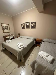 Postel nebo postele na pokoji v ubytování B&B Emmanuel