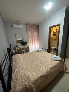 Postel nebo postele na pokoji v ubytování B&B Emmanuel