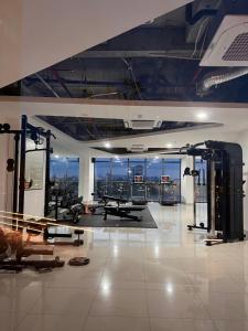 a gym with a view of a city skyline at Chi Homestay Nera Garden Huế in Hue