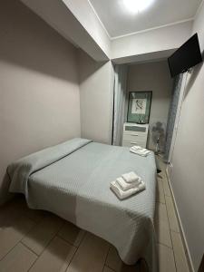 Postel nebo postele na pokoji v ubytování B&B Emmanuel