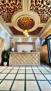 a lobby with a bar in a building at Sidi Mehrez HOTEL in Tunis