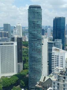 a tall building in the middle of a city at Vortex Premium Suites KLCC by SCHIEN in Kuala Lumpur