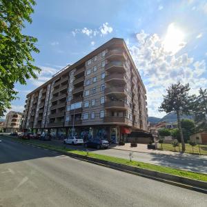 a tall building on the side of a street at Venus Deluxe Apartment in Strumica