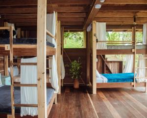a room with a bunch of bunk beds at The Fort Hostel in Don Diego