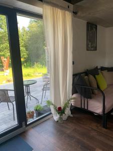 a bedroom with a bed and a patio with a table at Casa di Giacobbe Loft apartment Amalfi in Frýdlant nad Ostravicí