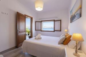 En eller flere senge i et værelse på Sa Marina 7A