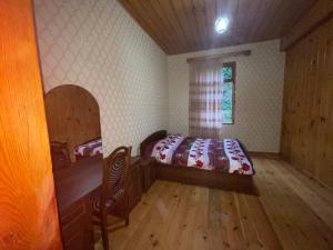 a bedroom with a bed and a window at Mountain Heaven 