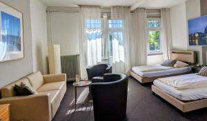 Postel nebo postele na pokoji v ubytování Hotel Schweizerhaus