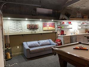 a living room with a couch and a pool table at Cozy Barn with Pool Access & Near Lake Conroe in Montgomery