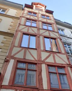 a tall building with windows on the side of it at Toscana - Luxury Duplex Rouen in Rouen