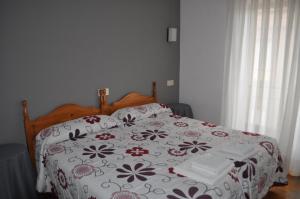 Postel nebo postele na pokoji v ubytování Hostal La Tablada