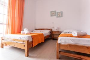 Posteľ alebo postele v izbe v ubytovaní Mike's Apartments