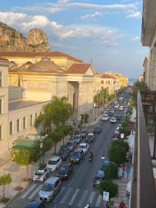 a busy city street with cars parked on the road at Corso 104 in Terracina