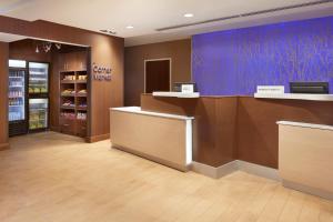 a store lobby with a checkout counter and a pharmacy at Fairfield Inn & Suites by Marriott Barrie in Barrie