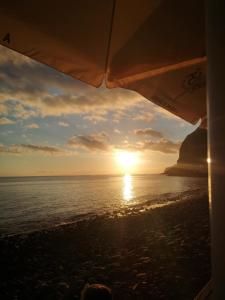 a view of the sunset from the beach at Isabela House in Ponta do Sol