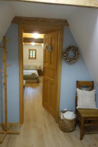 a room with a door leading to a bedroom at Rábenka in Janov nad Nisou +20 photos