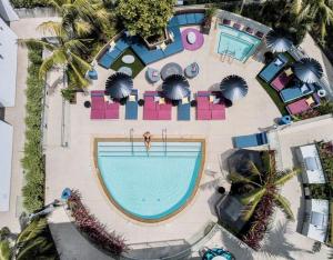 an overhead view of a swimming pool at a resort at Beverly Grove Chic City Oasis 2 BR Apt with Den 138 in Los Angeles