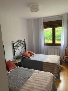 Postel nebo postele na pokoji v ubytování El Descanso del Cares