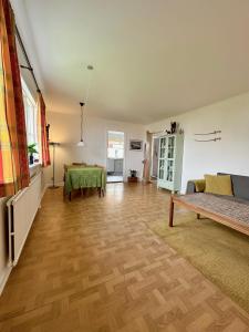 een woonkamer met een bank en een tafel bij Beautiful house in Skopun with jacuzzi in Skopun