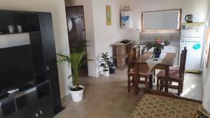 a kitchen and dining room with a table and a dining room at Luna Nueva in Concepción del Uruguay