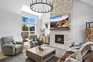 a living room with a couch and a fireplace at The Willow at McCall in McCall