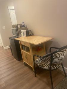 a wooden desk with a chair in a room at Rockwood House in Nanaimo