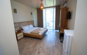 Postel nebo postele na pokoji v ubytování Hotel Leonardo
