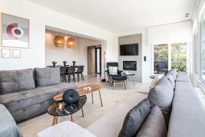 a living room with a couch and a table at Villa Mare in Makri