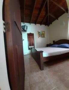 เตียงในห้องที่ Apartamentos en Mérida Mejor precio garantizado