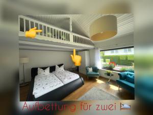 a bedroom with a bed and a living room at Ferienhaus Nadine 2023 komplett saniert in Bad Brambach