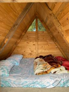 Postel nebo postele na pokoji v ubytování Mini Cabaña Roca Glamping