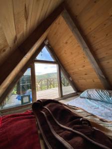 Postel nebo postele na pokoji v ubytování Mini Cabaña Roca Glamping