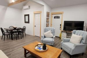 a living room with a table and chairs at Bethel Woods Cabin in Mongaup Valley